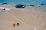 Shoes On The Beach Stock Photo