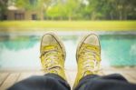 Relaxing By Pool With Dirty Shoes Stock Photo