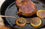 Pork Chop Seared On Iron Skillet Stock Photo