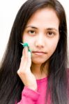 Girl Wiping Oily Skin Stock Photo