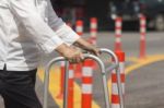 Senior Woman Using A Walker Cross Street Stock Photo