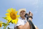 Photographer Man And Sun Flower Stock Photo