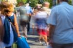 Blurry People Walking In The Street Stock Photo