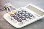 Calculator With Keys On Grey Background Stock Photo