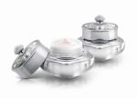 Two Silver Deluxe Cosmetic Jar On White Background Stock Photo