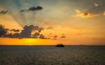 Scenery Of The Sea During Sunset With Ferry Stock Photo