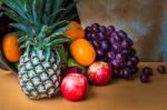 Assorted Fruits Placed On A Wooden Stock Photo