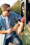 Portrait Of Two Friends Talking And Laughing In The Car Stock Photo