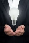 Business Hand Holding Light Bulb Stock Photo