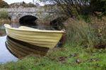 Llanberis, Wales/uk - October 7 : Yellow Rowing Boat On A River Stock Photo