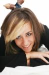 Smiling Woman Lying In Bed Stock Photo