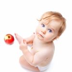 Cute Infant Boy With Apple Stock Photo