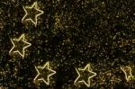 Golden Decoration Light In Shape Of Star On Christmas Pine Tree Stock Photo