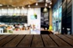 Selected Focus Empty Brown Wooden Table And Coffee Shop Or Resta Stock Photo