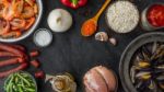 Ingredients For Paella On The Dark Stone Table Horizontal Stock Photo