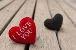 Red And Black Heart On Wood Floor Stock Photo