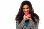 Relaxed Mixed Race Woman Having Coffee Stock Photo