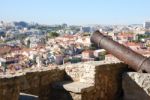 Cityscape Of Lisbon In Portugal With Cannon Weapon Stock Photo