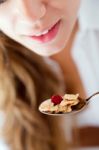 Young Woman In Underwear Eating Cereals. Isolated On White Stock Photo