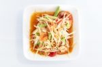 Thai Food Papaya Salad On White Dish Stock Photo