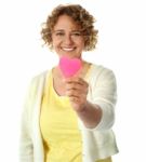 Happy Woman Offering Her Heart Stock Photo