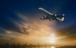 Passenger Plane Flying On Beautiful  Dusky Sky Stock Photo