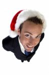 Posing Businessman With Christmas Cap Stock Photo