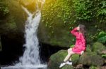 Summer Portrait Of Young  Women Enjoying Nature  In Tight Fitting Red Dress Summer Vacation,sunny,having Fun, Positive Mood,romantic, Against Background Of Summer Green Park, Green Leaves Stay Outdoor Stock Photo