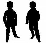 Silhouettes Of Two Little Boys Stock Photo