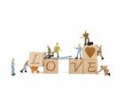 Miniature Worker Team Building Word Love On White Background Stock Photo