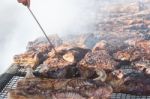 Traditional Meat Grilled On The Grill In The Argentine Countryside Stock Photo