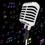 Microphone Music Closeup With Musical Notes Shows Songs Or Hits Stock Photo