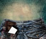 Blue Jeans With Cell Phone, Flashlight And Passport In A Pocket Stock Photo