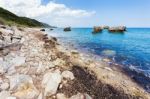 Landscape With Boulders And Rocks On Coast With Blue Sea Stock Photo