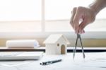 Close-up Of Person's Engineer Hand Drawing Plan On Blue Print Wi Stock Photo