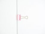 Pink Paperclip Attached On White Paper Isolated Stock Photo