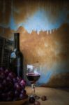 Grapes And Wine Glasses On A Wooden Stock Photo