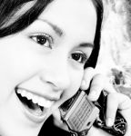 Girl Talking On The Phone And Standing Outside Stock Photo