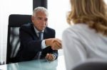 Managers Shaking Hands Stock Photo