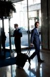 Man Entering Hotel With Luggage Stock Photo