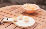 Mini Chinese Cakes On Wooden Plate Stock Photo