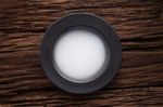 Black Empty Bowl On Wooden Table Background Stock Photo