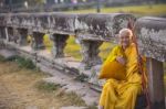 An Unidentified Old Buddhist Female Monk Dressed In Orange Toga Stock Photo