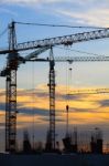 Crane Of Building Construction Against Beautiful Dusky Sky Stock Photo