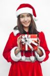 Santa Claus Hat With Red Christmas Gift Box Stock Photo