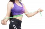 Woman In Sport Bra Measuring Her Body With Tape Isolated On Whit Stock Photo