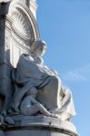 Statue Of A Woman With Children At The Victoria Memorial Outside Stock Photo