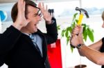 Woman Threatening Her Boss, Holding Hammer Stock Photo