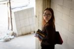 A Businesswoman Holds A Calculator While Walking Down A Stairwel Stock Photo