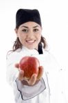 Female Chef Showing Red Apple Stock Photo